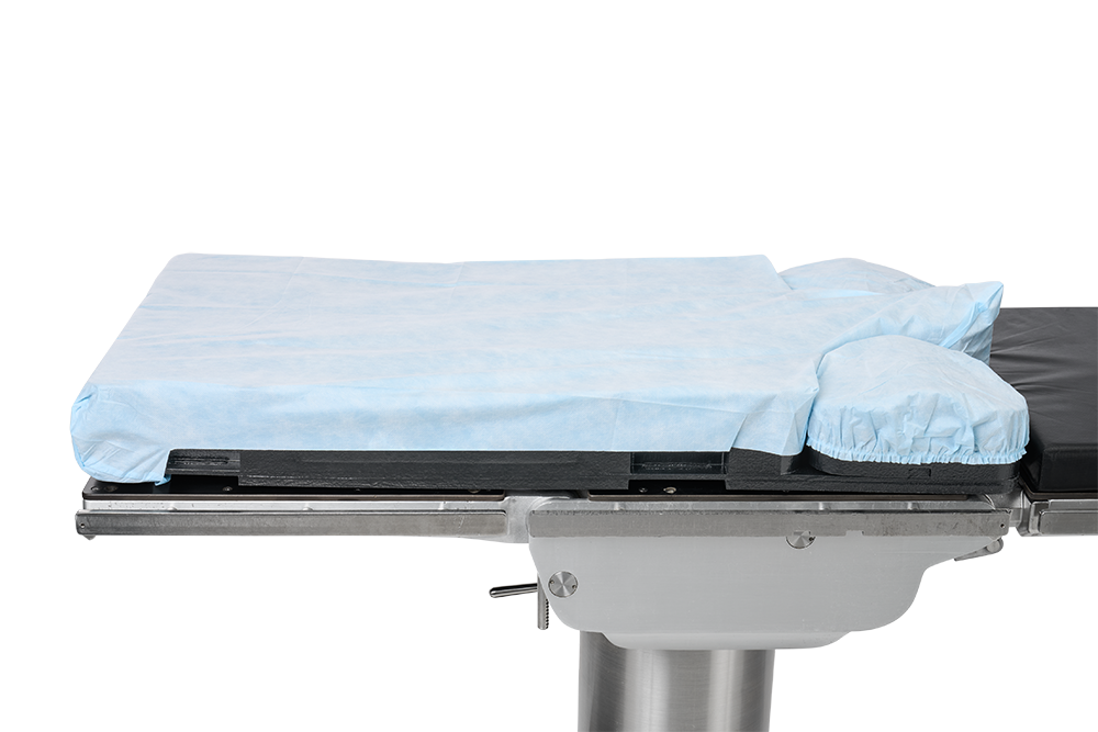 A padded medical examination table with a light blue cover.