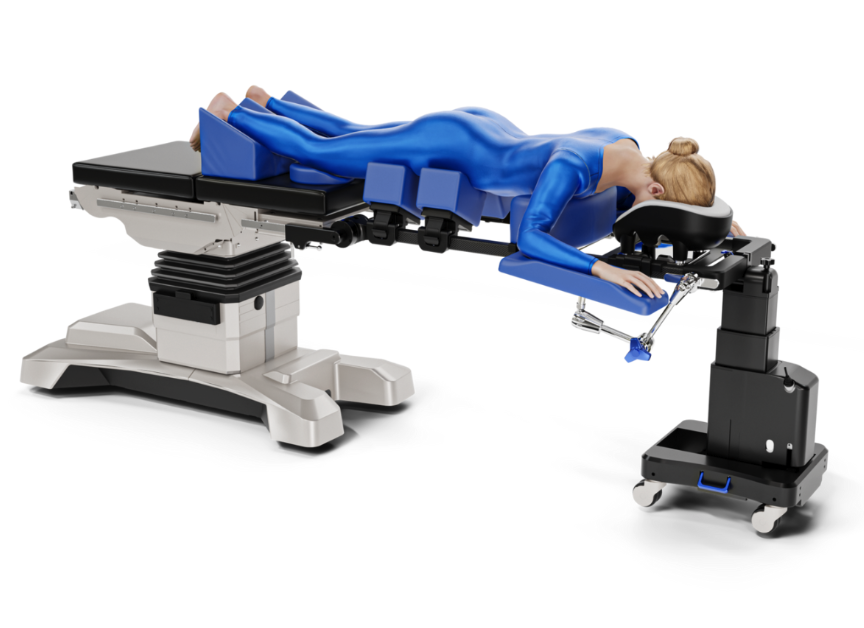 Patient in blue hospital gown on an adjustable medical table.