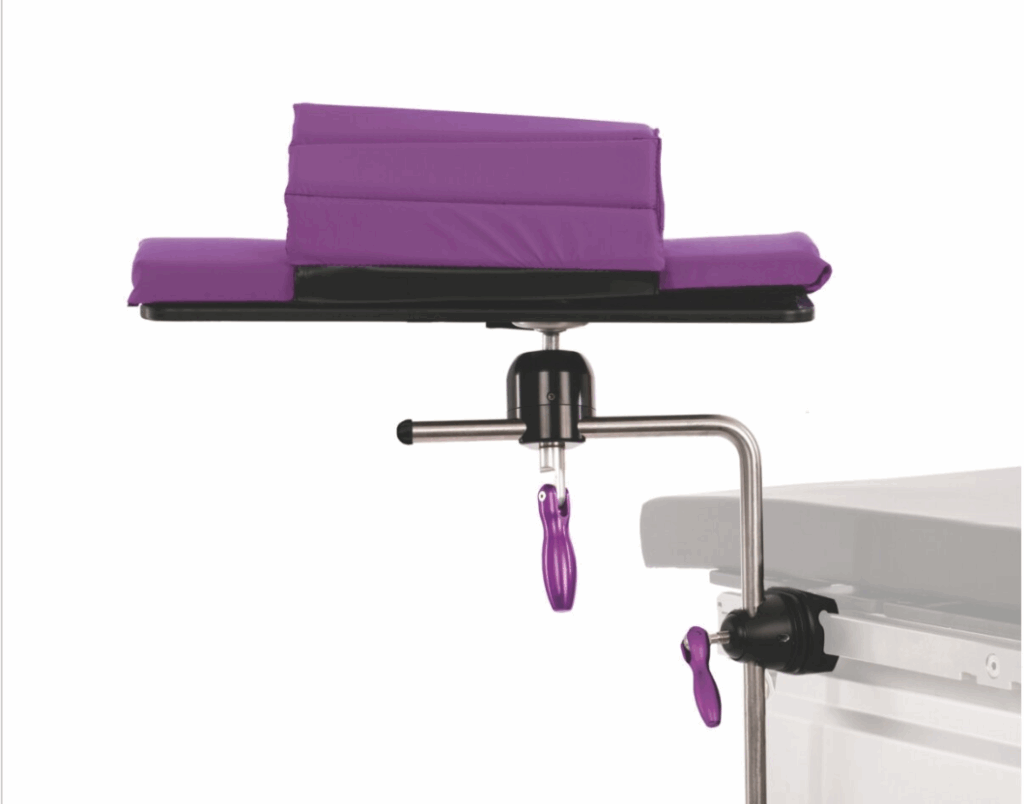 Purple surgical armrest attached to an operating table.