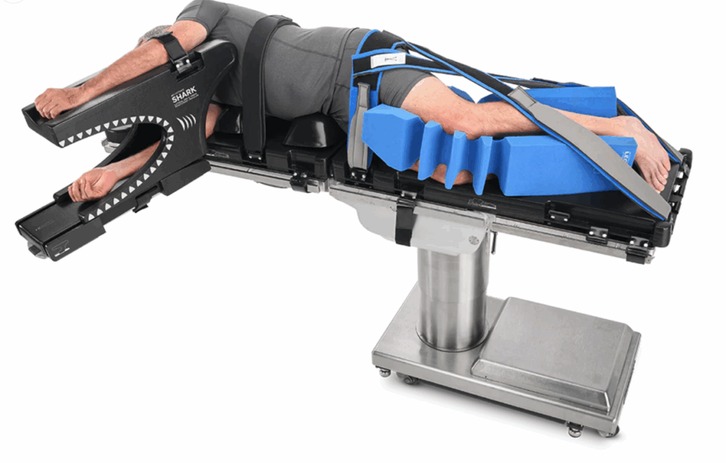 A robotic arm with blue cushioned segments on a metal base.