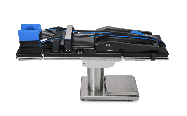 Modern medical examination table with adjustable features and ergonomic design.