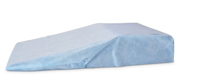 Blue disposable medical bed sheet covering a mattress.