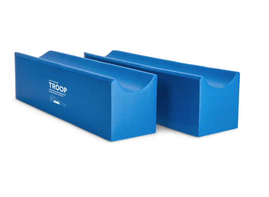 Two blue foam yoga blocks with a logo on them.