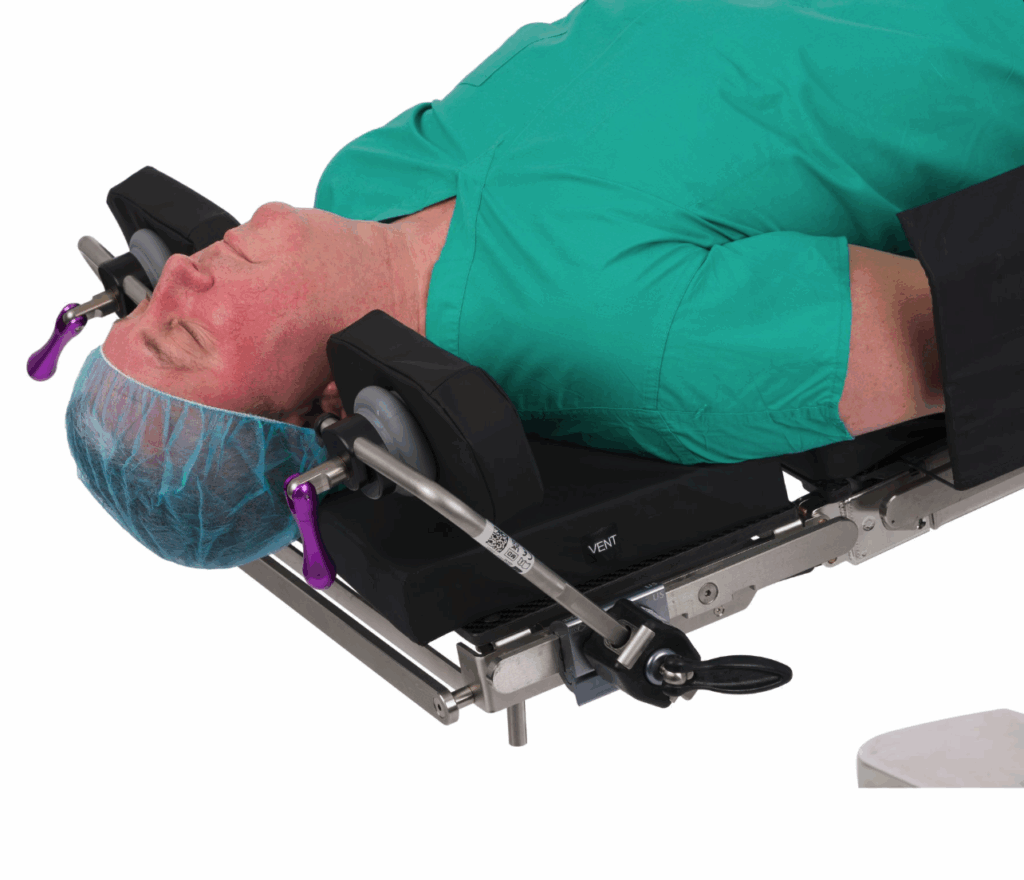 Patient positioned for surgery on an operating table with head stabilized.