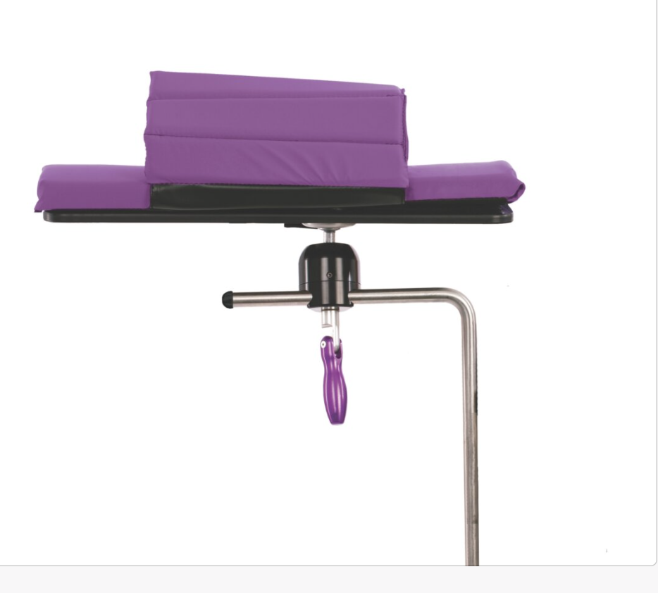 Adjustable purple armrest on a metal stand.
