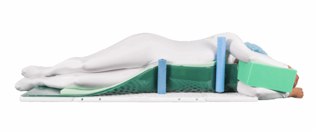 A side view of a person lying on a mattress with spinal alignment support.
