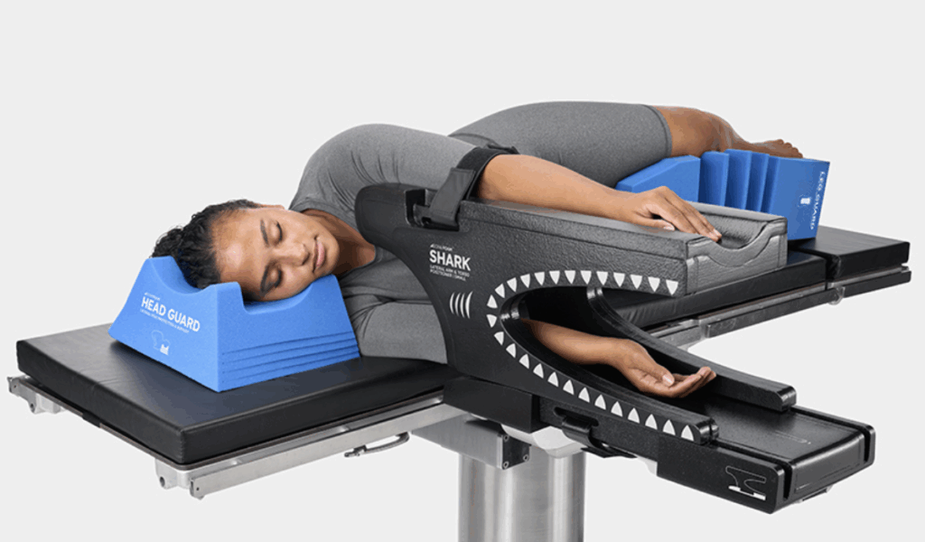 A person undergoing spinal decompression therapy on a medical table.