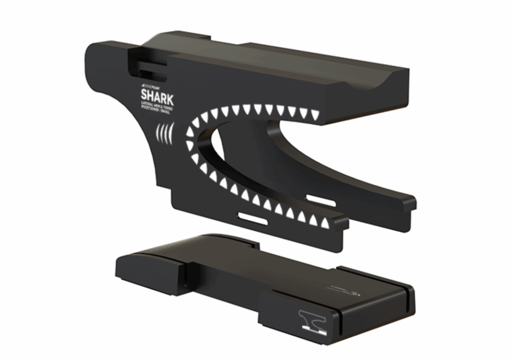 Black guitar capo with shark teeth design.