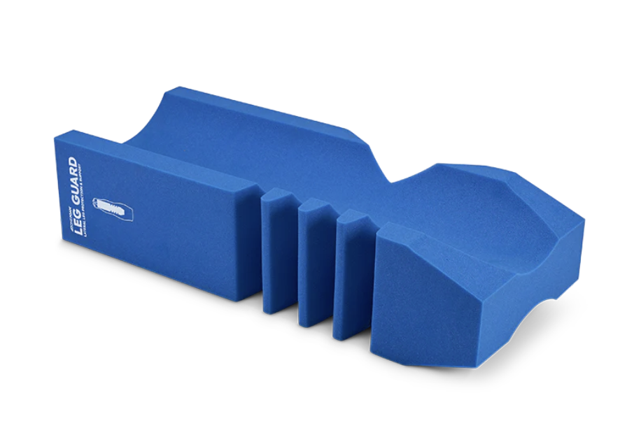 Blue silicone mold with multiple compartments and grooves.