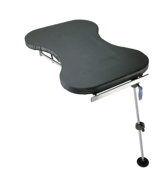 Adjustable black laptop desk with leg support.
