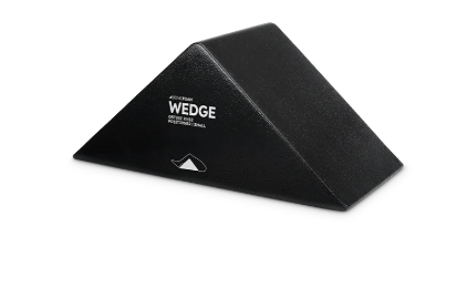 Black foam wedge pillow with a textured surface.