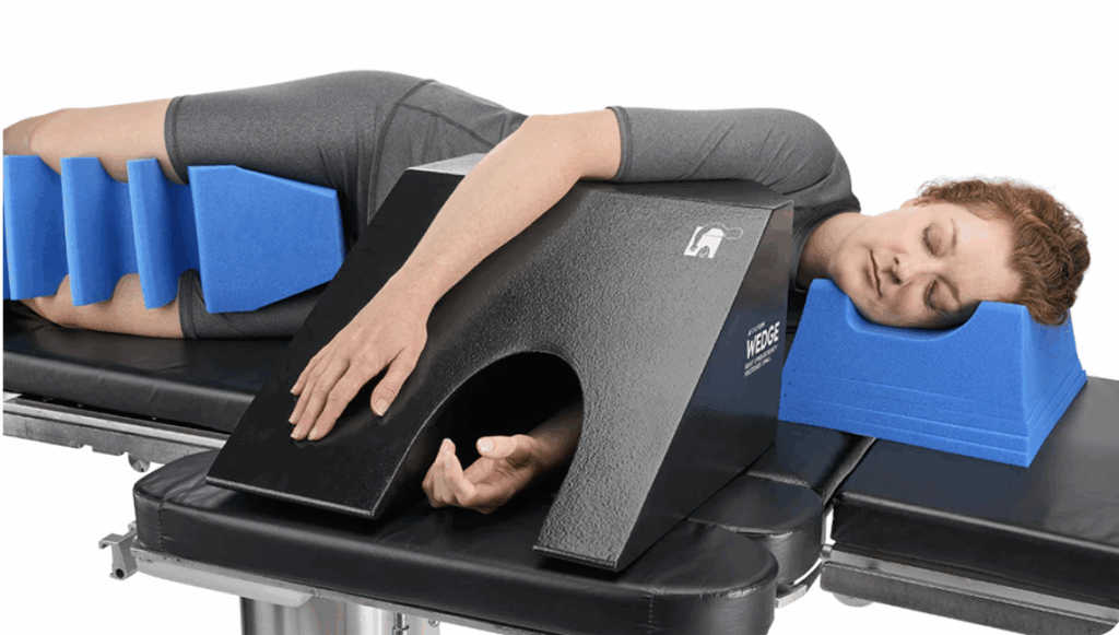 Person using a modern physical therapy device for arm treatment.