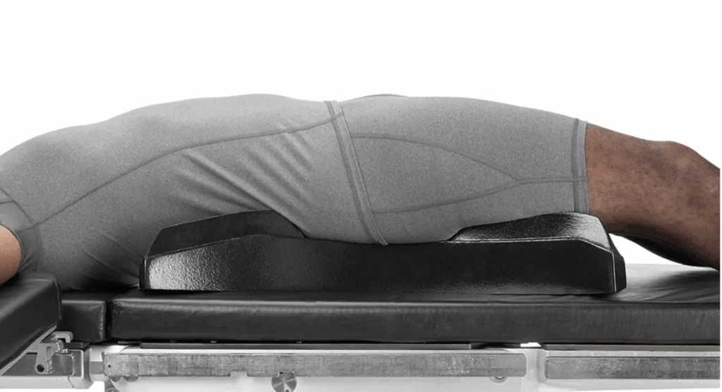 Person performing a plank exercise on a bench.