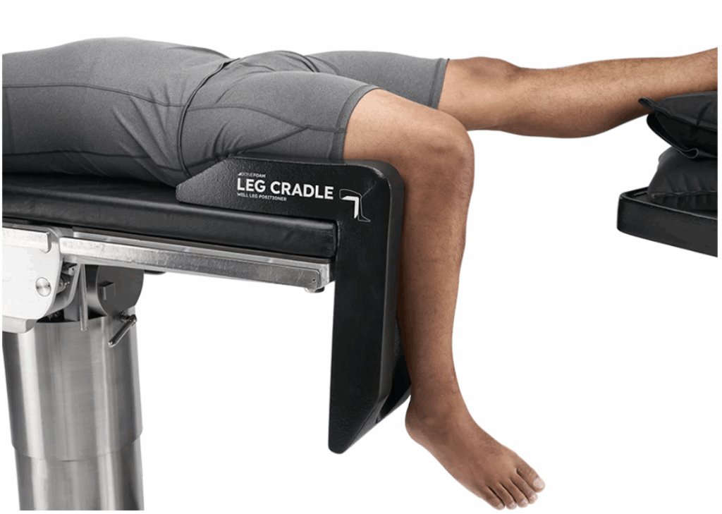 Person using a leg cradle for support on a bench.