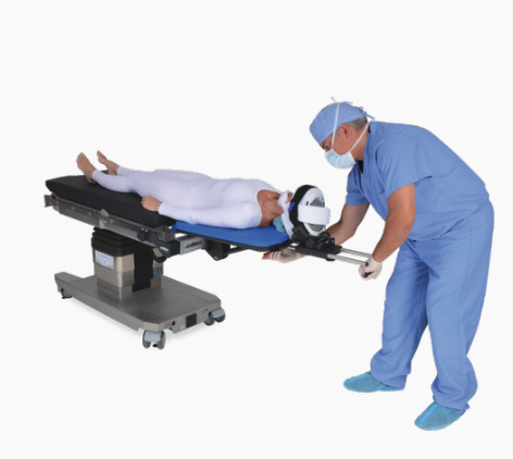 A patient lying on an operating table with a medical professional preparing for surgery.