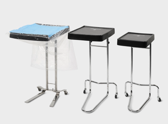 Three medical instrument trays on stands with wheels and legs.