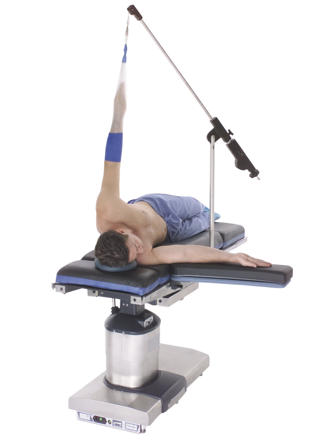 A person exercising shoulder stretch with a resistance band on a bench.