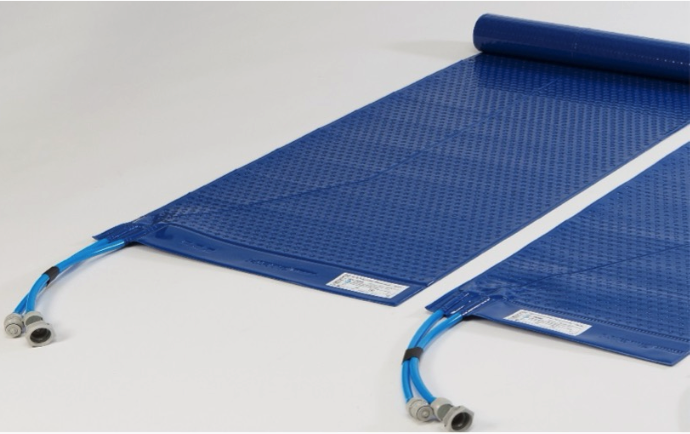 Blue industrial hose or mat with a connector on a white background.