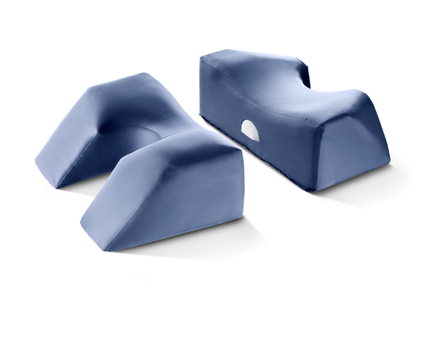 Two blue foam cushions with ergonomic shapes and a hole in one.
