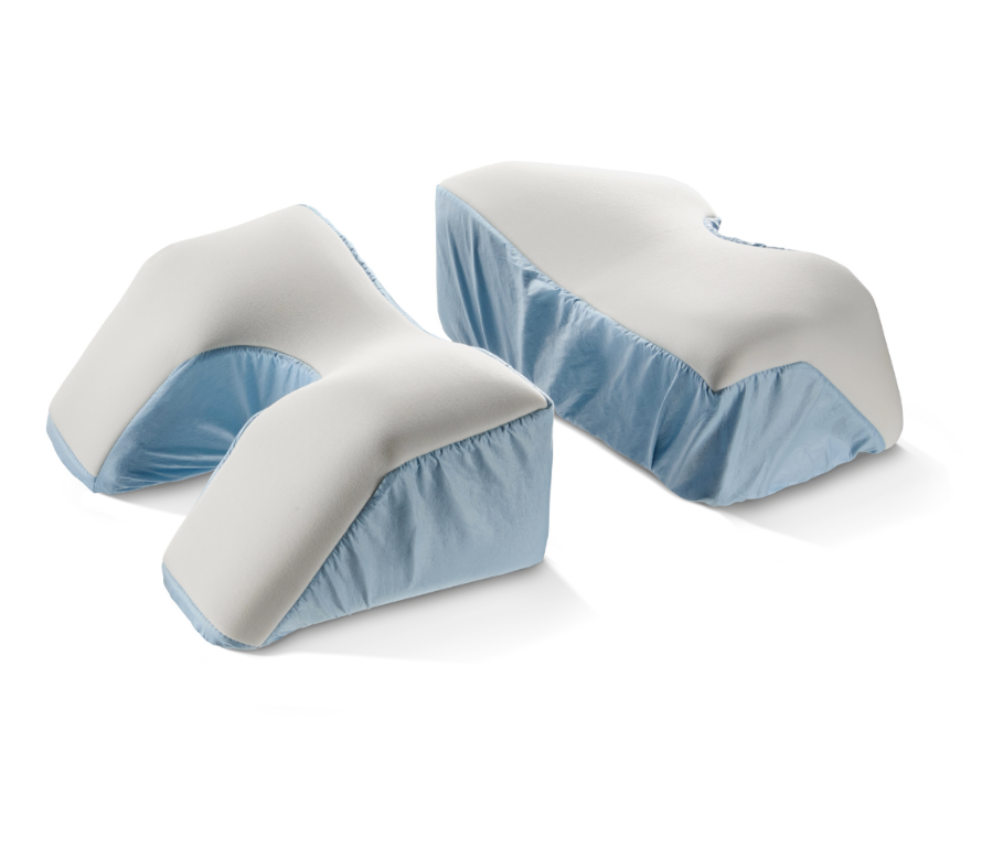 Set of orthopedic leg pillows with blue covers for elevation and support.